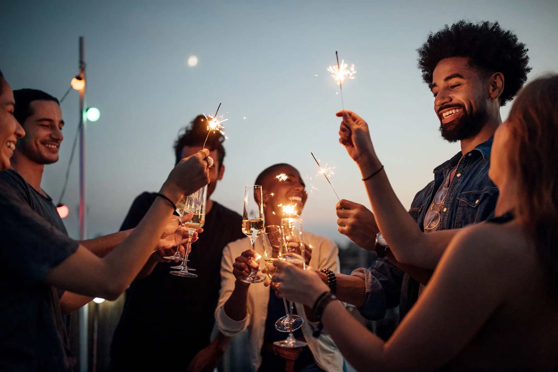 Friends enjoying an evening with sparklers